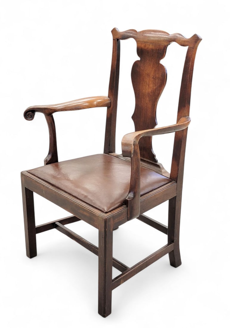CHIPPENDALE ARMCHAIR: Probably Pennsylvania, late 18th century, walnut. Vasiform back splat and scrolled arms. Straight legs and seat rail. Leather upholstered seat. 40.5" high. Provenance: from a Midwestern collection. Pi