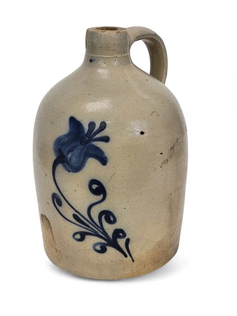 STONEWARE JUG WITH TULIP: Possibly New York, 2nd half-19th century. Salt-glazed stoneware jug with tooled neck and excellent slip-trailed tulip design in bold cobalt with clear edges, scrolled leaves along stem. Cobalt outline