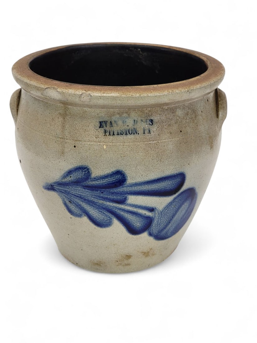 EVAN B. JONES, PITTSTON COBALT-DECORATED STONEWARE CROCK: Pennsylvania, 1870s or 1880s. Salt-glazed stonware crock, ovoid shape with applied handles, tooled shoulder, rounded rim. Abstract tulip in brushed cobalt. Stamped "EVAN P. JONES / PITTSTON, PA", no c