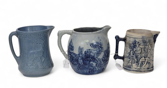 THREE MOLDED PITCHERS WITH HUNTING SCENES