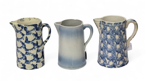 THREE BLUE AND WHITE MOLDED PITCHERS