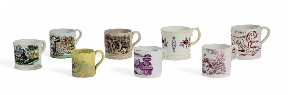 COLLECTION OF STAFFORDSHIRE MUGS: English, 19th century. Mostly child's mugs, including a canaryware mug with dog. 2.25" to 3.25" high. Provenance: an Ohio collection. Affordable, in-house shipping is available for this lot. Please co