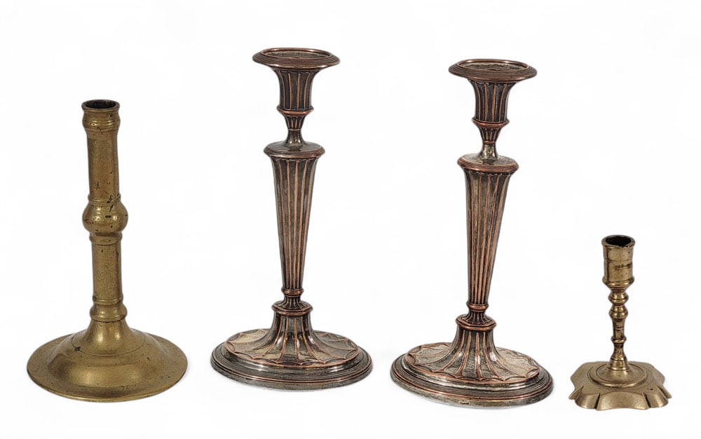 FOUR CANDLESTICKS: Group of four candlesticks. Pair of Barker-Ellis (English, late 20th century) silver-over-copper candlesticks, 12" high; early bell metal candlestick, 10" high; and small brass Queen Ann candlestick,