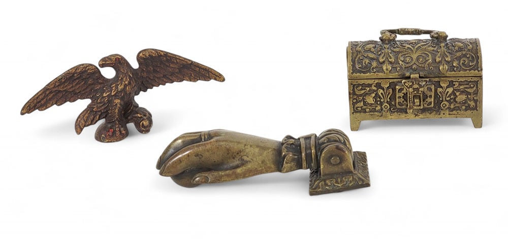 THREE EARLY BRASS ITEMS: 19th century. Includes a small medieval-style box, an eagle flagpole finial, and ball-and-hand doorknocker. Box is 4.75" long. Provenance: an Ohio collection. Affordable, in-house shipping is availabl