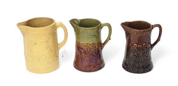 THREE MOLDED PITCHERS WITH BIRD SCENES