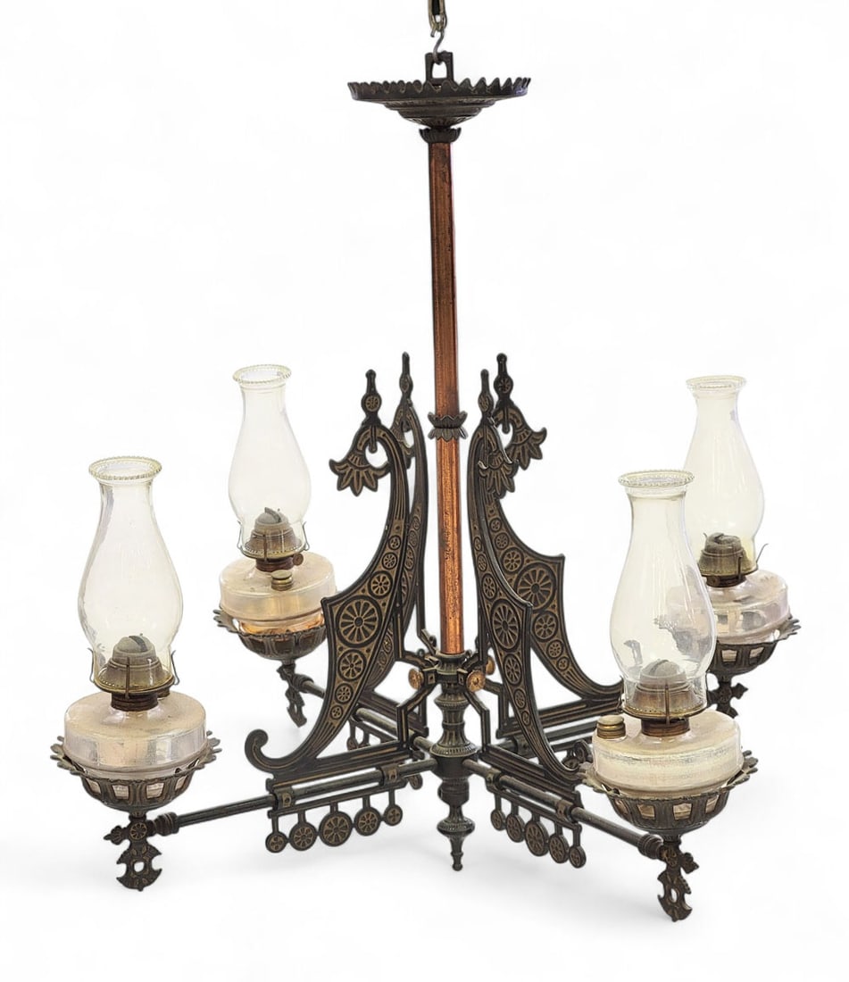 VICTORIAN CAST-IRON CHANDELIER: American, late 19th century. Four-arm chandelier, with fonts, burners, and shades. 34" high, 36" diameter. Provenance: a Midwestern collector Pickup or freight shipping is required for this lot. Pleas