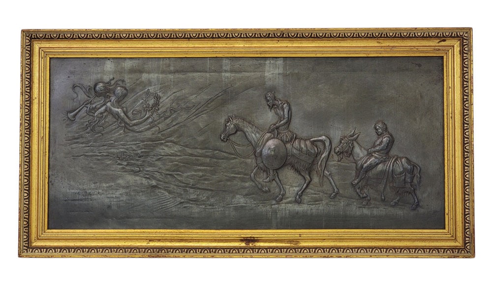RELIEF PLAQUE WITH DON QUIXOTE: European, 1st half-20th century. Patinated pressed tin plaque depicting Don Quixote and Sancho Panza approaching a city, with a depiction of his madness in the heavens. Framed, 15.5" high, 30.5" wide 