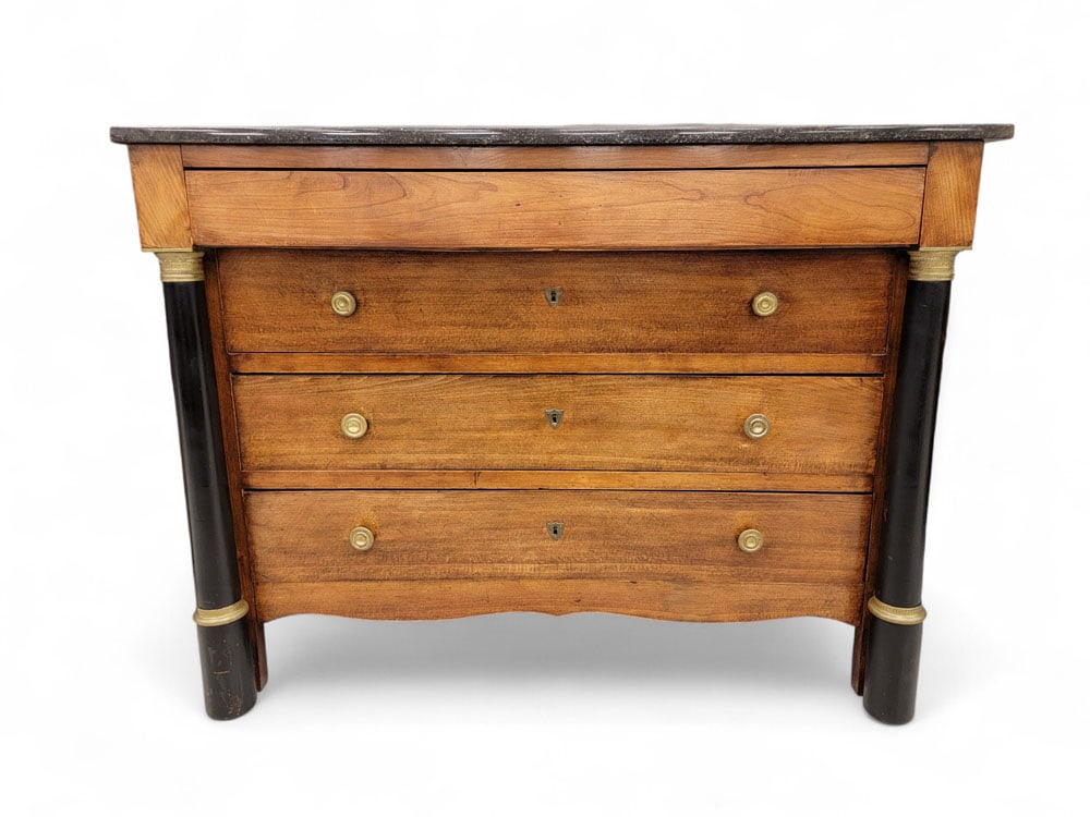 BIEDERMEIER CHEST OF DRAWERS: German or Austrian, 2nd quarter-19th century. With marble top and four drawers. Ebonized columns at sides with brass capitals and plinths. Brass knobs and escutcheons on lower three drawers, top drawe