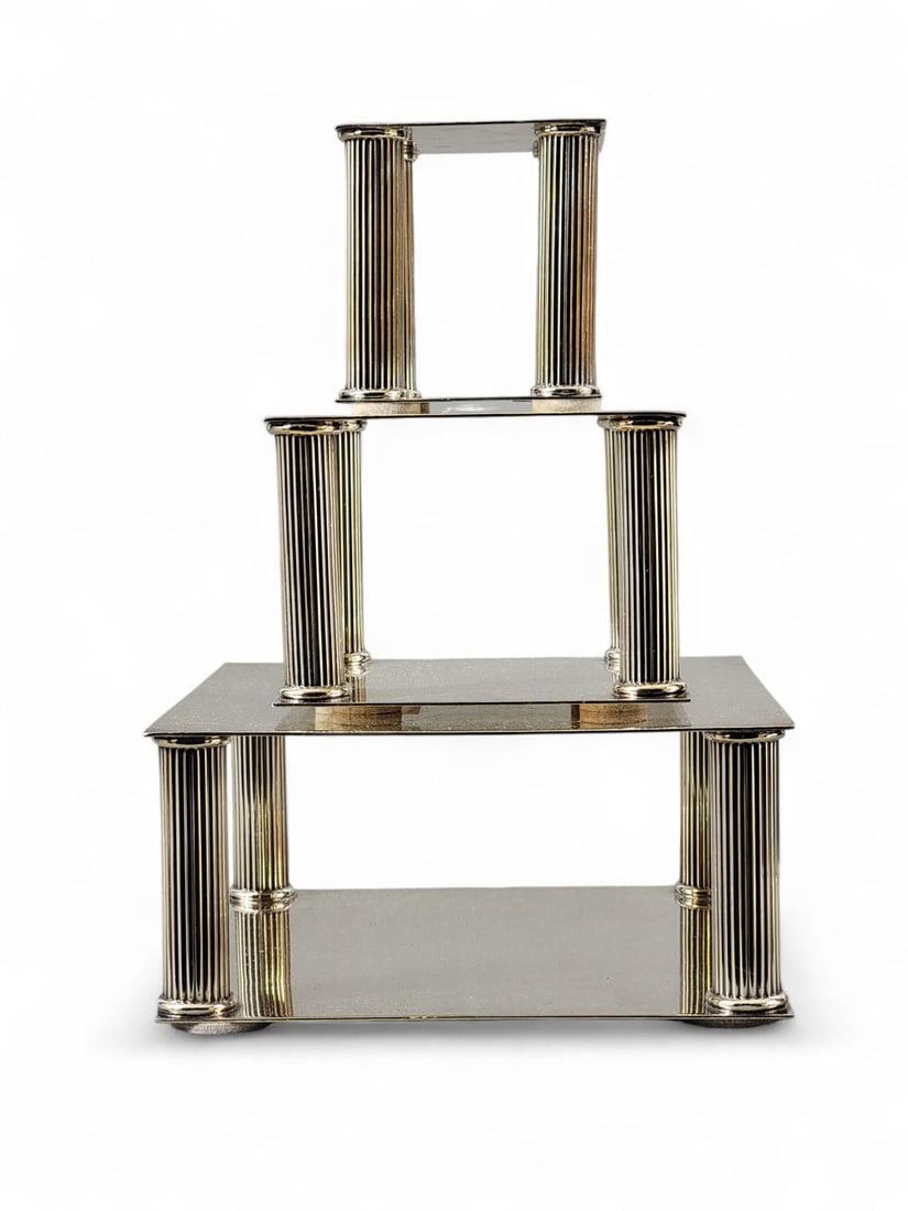 SET OF THREE NEOCLASSICAL CAKE STANDS/CENTERPIECES: Meridan B. Co. (American), 20th century. Elecroplated nickel silver. Plain square tops held up with Neoclassical fluted columns over plain square bases, felt pad feet. 4.5" high, 9" wide, 9" deep, 4.5