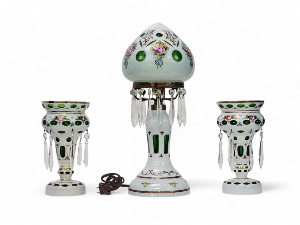BOHEMIAN GLASS LAMP WITH PAIR OF MATCHING LUSTERS: Czechoslovakia, late 19th-early 20th century. White cut to emerald green, adorned with hand painted polychrome floral and foliage motifs and gilding. Hanging crystal prisms on each, and brass shade su