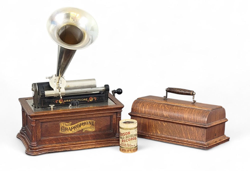 COLUMBIA GRAPHOPHONE BF PHONOGRAPH: Columbia Phonograph Co. "Graphophone," Type No. 6912. Oak case with molded base, paneled sides, and flush-mounted columns at corners. Lidded, domed top with bale handle and metal horn. Retains origina