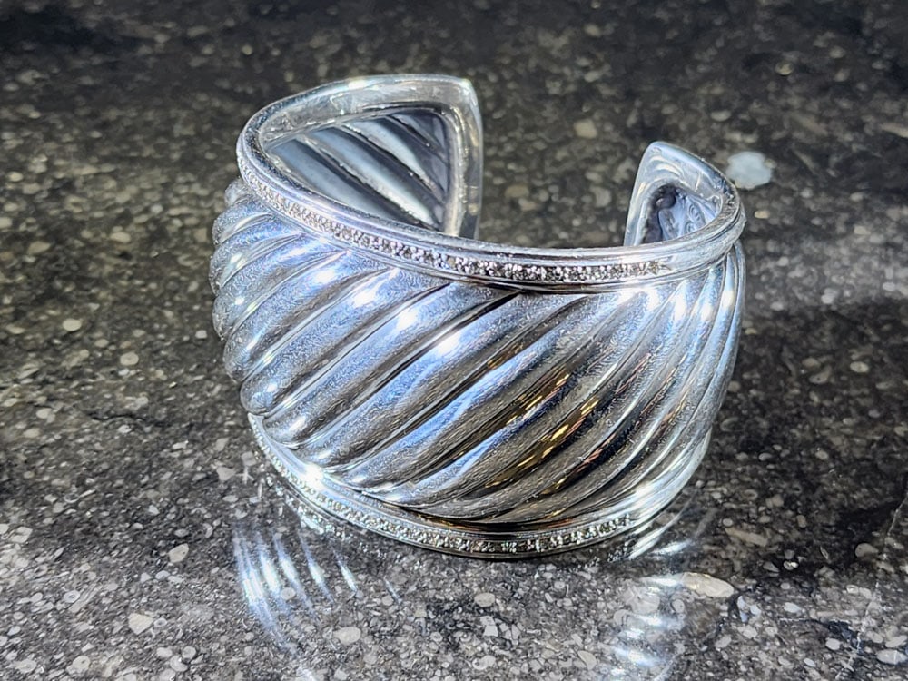 DAVID YURMAN CUFF BRACELET: Marked. Sterling silver and diamonds. 70g. Provenance: a Columbus, Ohio collection. Affordable, in-house shipping is available for this lot. Please contact us for a quote.