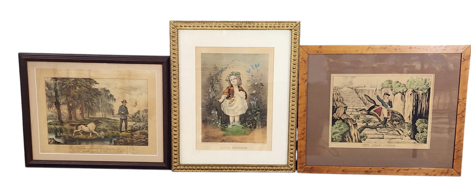 THREE CURRIER & IVES PRINTS: New York, 19th century. Small folios, includes Snipe Shooting, Little Blossom, and Gen. Israel Putnam. All framed, largest is 16" high, 20" wide (overall). Affordable, in-house shipping is available f