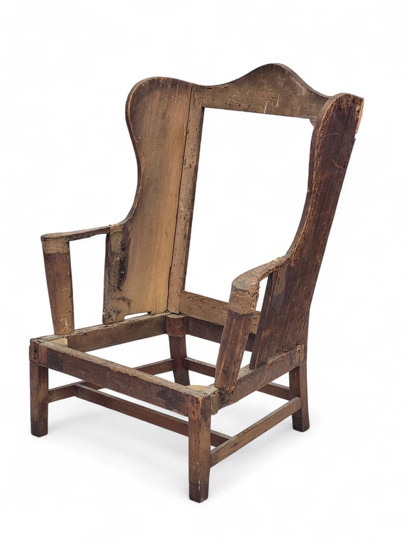 CHIPPENDALE EASY CHAIR: Probably Philadelphia, Pennsylvania, 1780-1800, mahogany and poplar. Vertical scrolled arms and simple straight legs. 45" high (crest); 12" high (seat). Provenance: an Ohio collection. PLEASE NOTE OUR