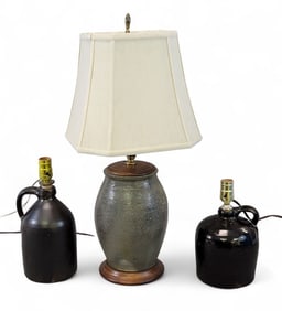 THREE STONEWARE LAMPS