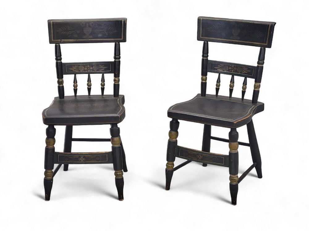 PAIR OF DECORATED WINDSOR CHAIRS: American, 1820-1840, mixed woods including poplar. Half-spindle windsors with their original black paint and stenciled/freehand decoration, including on the flat front stretcher. 32" high. Provenance: