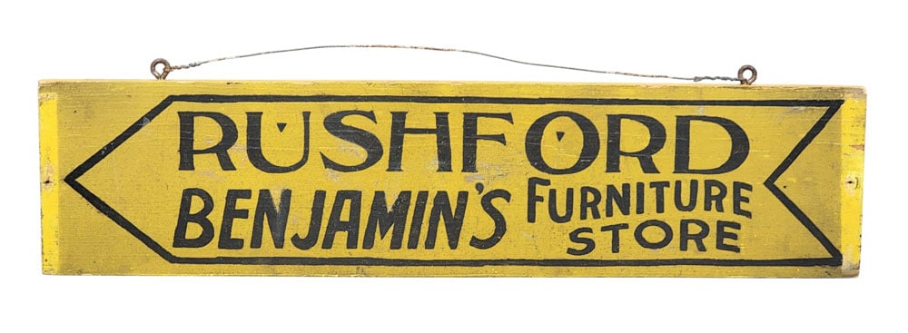 NEW YORK STATE FURNITURE TRADE SIGN: Early 20th century. For Benjamin's Furniture Store in Rushford, with original black and yellow paint. 5.75" high, 24" long. Provenance: from a New York collection. PLEASE NOTE OUR SHIPPING PROCESS. Th