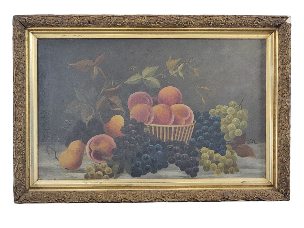STILL LIFE WITH FRUIT: American, 2nd half-19th century, oil on canvas. Peaches in a basket, surrounded by grapes and a pear. In a period gilt frame. 15.5" high, 25" wide (sight); 20.5" wide, 30.25" wide (overall).