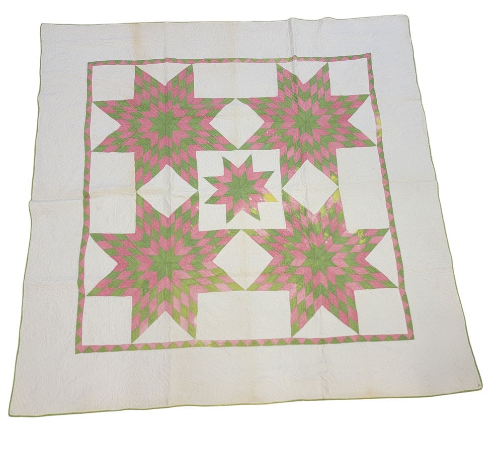 OHIO BETHLEHEM STAR QUILT: Trumbull Co., Ohio, 19th century, cotton. A Bethlehem Star quilt composed of solid pink and green fabrics on a solid white ground, with a zigzag/sawtooth border. Hand-stitched and quilted. Purported t