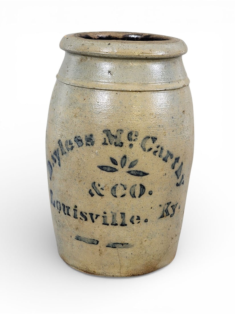 KENTUCKY STONEWARE CANNING JAR: Southwestern Pennsylvania, c. 1875, retailed by Bayless and McCarthey, Louisville. Cobalt stenciled decoration. 8.5" high. Provenance: the collection of the late Dr. Jerry Phelps, Prospect, Kentucky.
