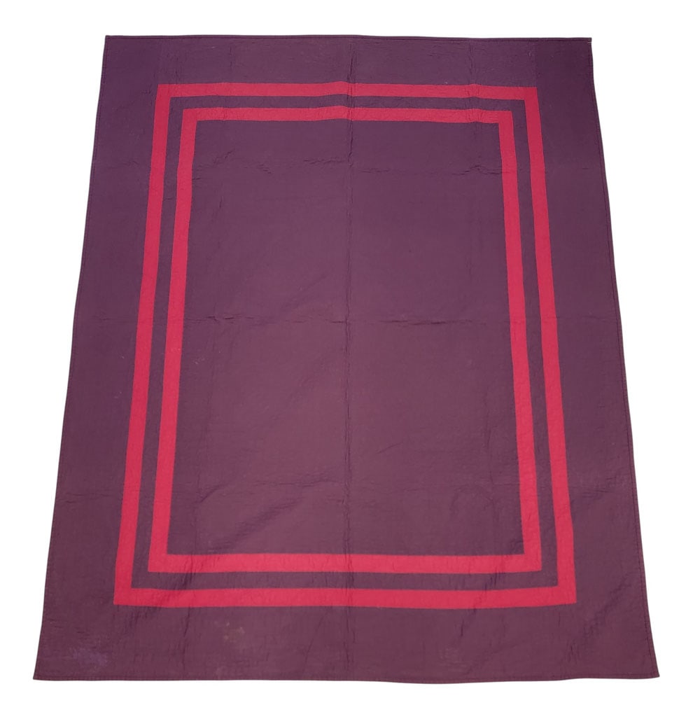 AMISH QUILT: Holmes County. Reversible plain quilt, hand-stitched and quilted, with plum purple on one side and dark teal on the other. 85" by 69". Provenance: an Ohio collection. NOTE: We are happy to answer ques