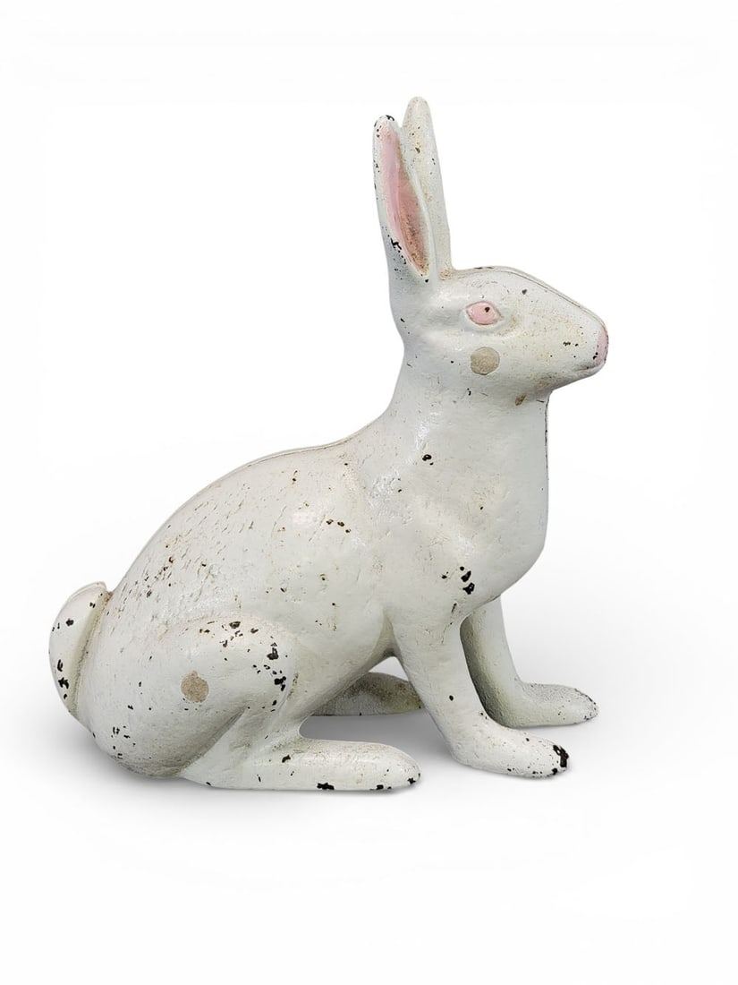 CAST IRON RABBIT DOORSTOP: Unmarked but likely by Kramer Brothers, Dayton, late 19th-early 20th century. Seated rabbit with old pink and white paint. 11" high. Provenance: an Ohio collection. NOTE: We are happy to answer questi