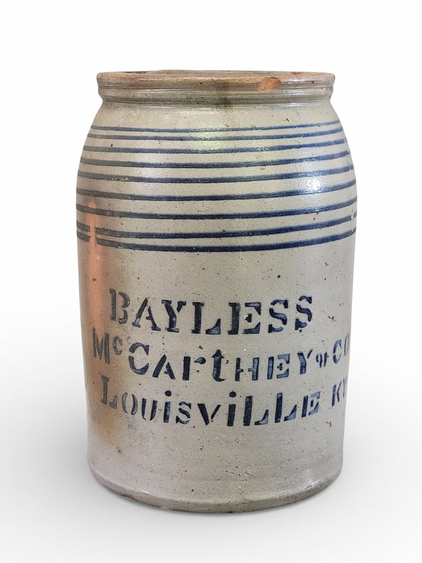 KENTUCKY STONEWARE CANNING JAR: Southwestern Pennsylvania, c. 1875, retailed by Bayless and McCarthey, Louisville. Wax sealer with cobalt stenciled decoration, including stripes. 8.5" high. Provenance: the collection of the late Dr.