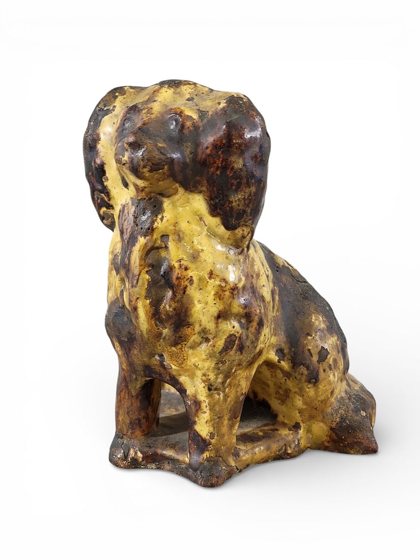 GLAZED REDWARE SPANIEL: Possibly Galena, Illinois, mid-19th century, glazed redware. A Rockingham-glazed spaniel, facing forward. 9" high, 6.5" wide, 7" deep. For another example that appears to be from the same mold, see Da