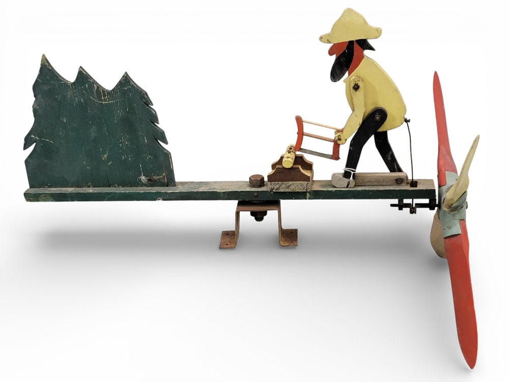 WHIRLIGIG WITH MAN SAWING: American, mid-20th century, wood. Original paint. 33" long. Provenance: a West Virginia collection. NOTE: We are happy to answer questions and take additional photos of lots prior to the auction (the