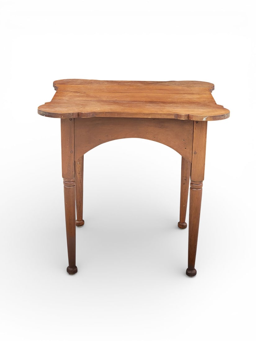 PORRINGER-TOP TAVERN TABLE: American, c. 1820s-30s, cherry. A tavern table with porringer top, arched apron, turned legs, button feet. 29" high, 30" wide, 29.75" deep. Provenance: an Ohio collection. NOTE: We are happy to answer