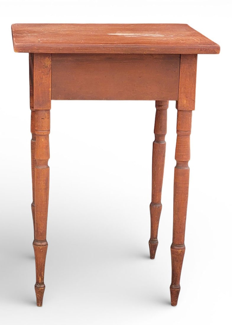 PAINTED ONE-DRAWER STAND: American, first half 19th century, cherry. With squared top, turned legs, cut nail construction, and retaining its original red/rust stain/paint. Underside inscribed "H THAA." 28.5" high, 20.5" wide, 