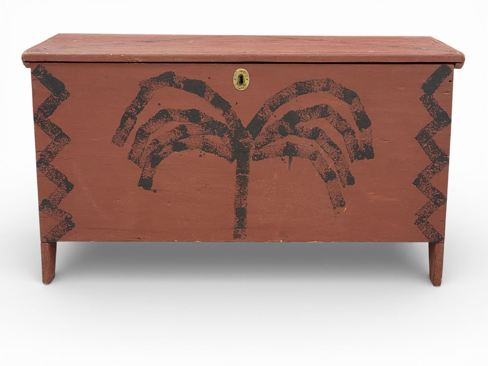 DECORATED BLANKET CHEST: American, c. 1820, pine. A six-board blanket chest with till, painted red with sponge-decorated willow tree on sides (not original). Underside of lid and top of till lid inscribed "Rose Lippold." 16" 