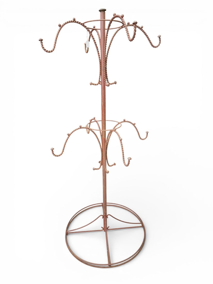 WIRE DISPLAY RACK: Possibly Maine, late 19th-early 20th century, iron. A store display rack with eight twisted wire arms, original red paint. Found in Maine. 56" high, 23" diameter. Provenance: a Pennsylvania collection