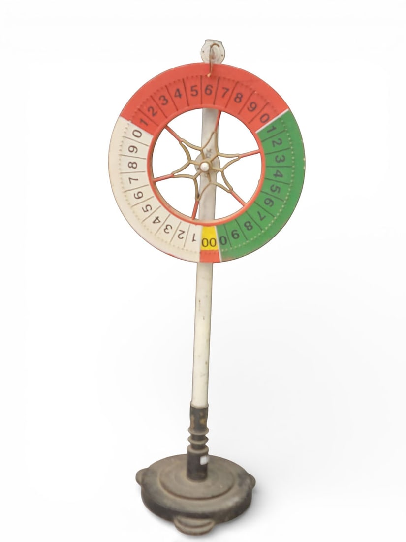 CARNIVAL GAME WHEEL: American, 2nd quarter-20th century. Original paint, and on a stand. 51" high, wheel is 20" diameter. Provenance: a West Virginia collection. NOTE: We are happy to answer questions and take additional 