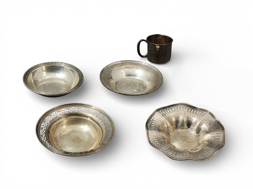 COLLECTION OF STERLING SILVER HOLLOWWARE: Collection of sterling hollowware, inc. Steiff and Towle. Engraved child's cup and four misc. nut dishes. Largest dish 1.25" high, 6.75" diameter. 545 g. Provenance: an Ohio collection. NOTE: We are h