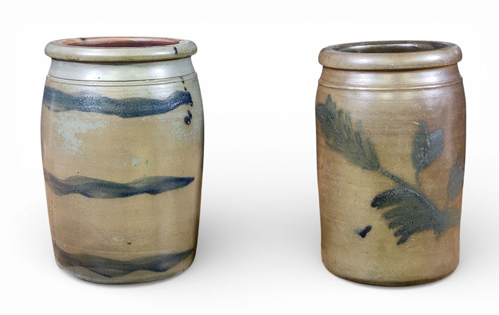 TWO PENNSYLVANIA STONEWARE JARS: Southwestern Pennsylvania, 1860-1880. Includes a "striper" with three cobalt stripes, 10" high; together with a jar with cobalt leaves. 9.75" high. Provenance: a West Virginia collection. NOTE: We