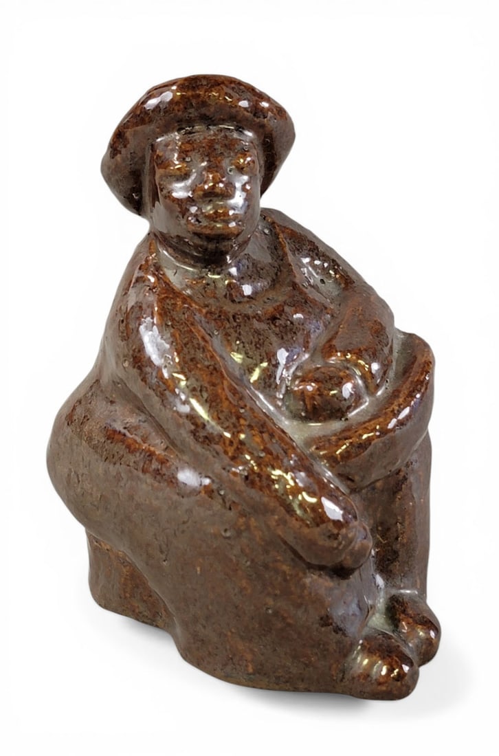 SEWER TILE FIGURE BY TIMMONS: Probably Ohio, early-mid-20th century, signed "Timmons" on the underside. Seated African American man wearing a hat. 6.5" high. Provenance: an Ohio collection. NOTE: We are happy to answer questions