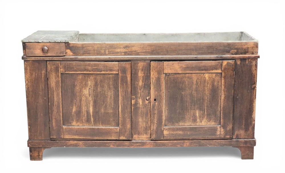 OHIO DRY SINK: Mid-19th century, walnut and poplar. One small drawer and two paneled drawers, with its original zinc lining. 32" high, 60" wide, 20.5" deep. Provenance: an Ohio collection. NOTE: We are happy to