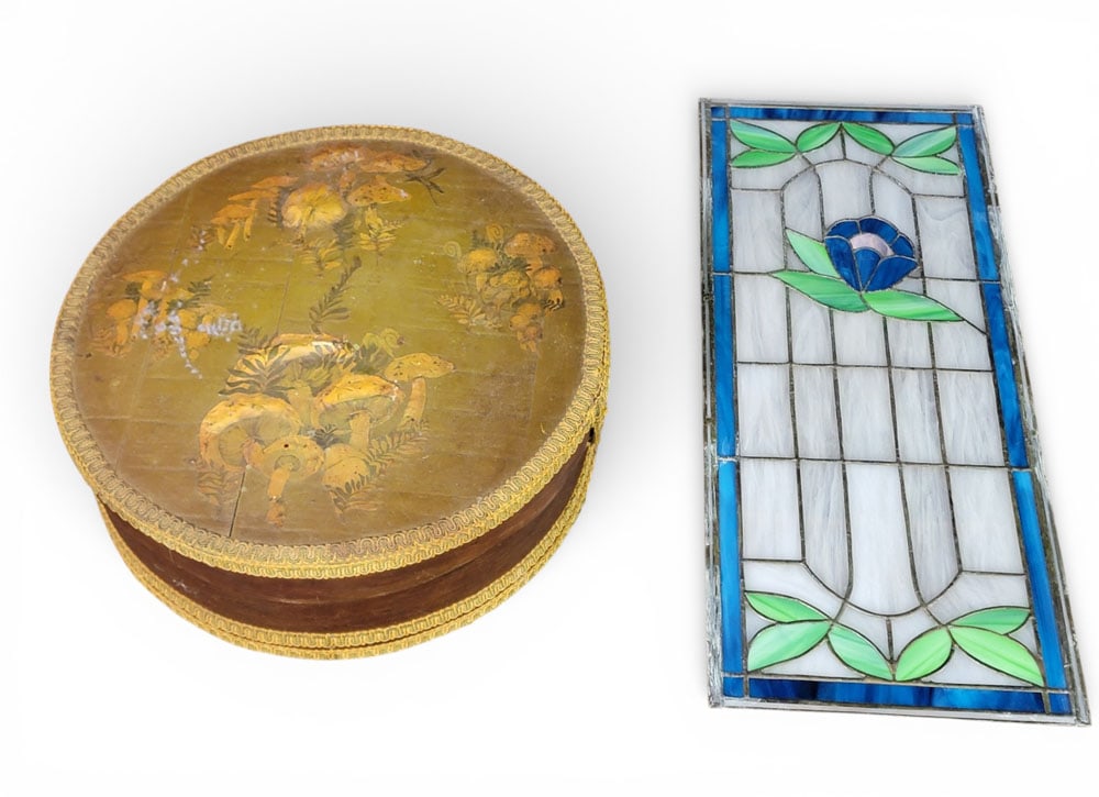CHEESE BOX AND STAINED GLASS WINDOW: American. Includes an unusually decorated cheesebox with mushrooms, 15.25" diameter; together with a stained glass panel with flower, 23.25" by 10". Provenance: a West Virginia collection. NOTE: We ar