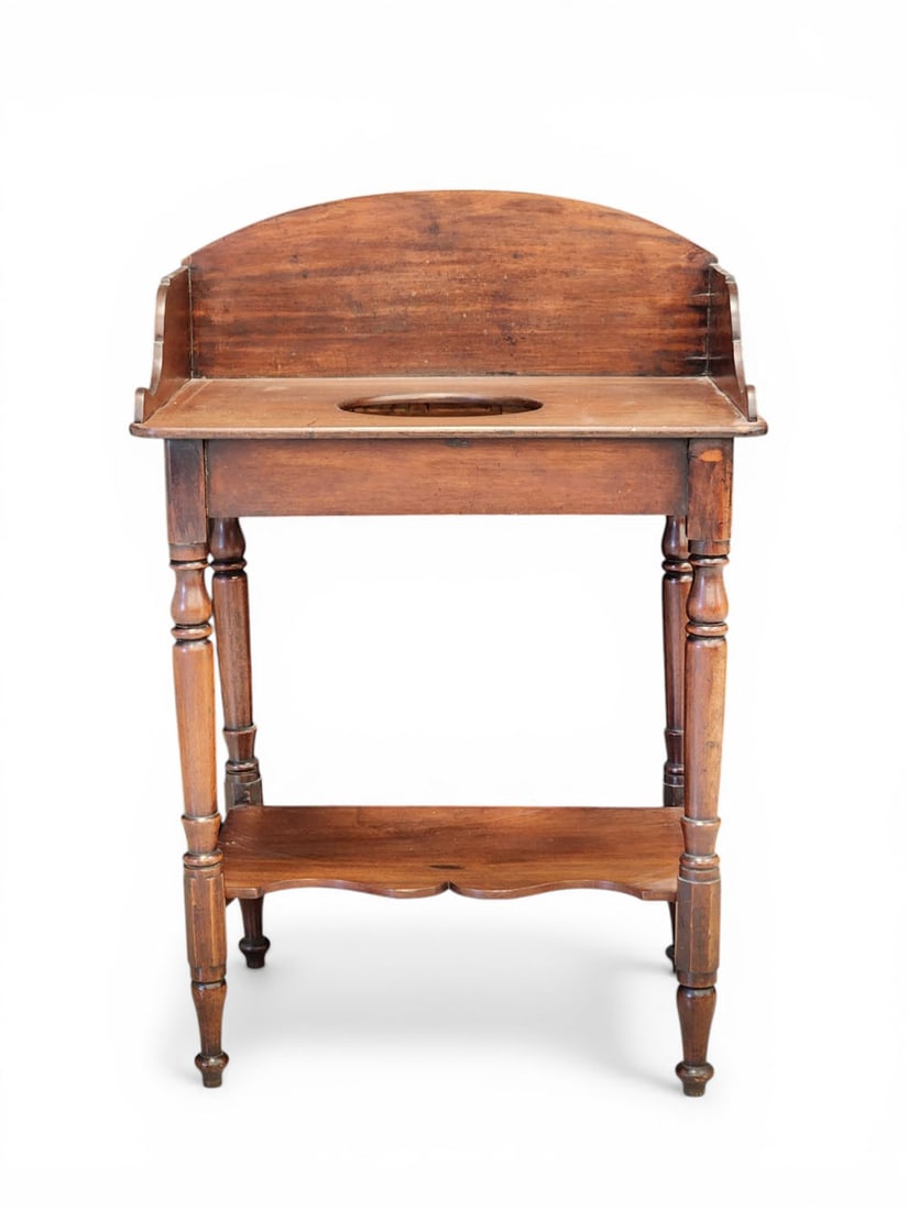 COUNTRY WASHSTAND: American, mid-19th century, walnut. Dovetailed gallery and shaped lower shelf. 39.25" high, 26.24" wide, 21" deep. Provenance: Collection of Bob and Maxine Edwards, New Philadelphia, Ohio NOTE: We