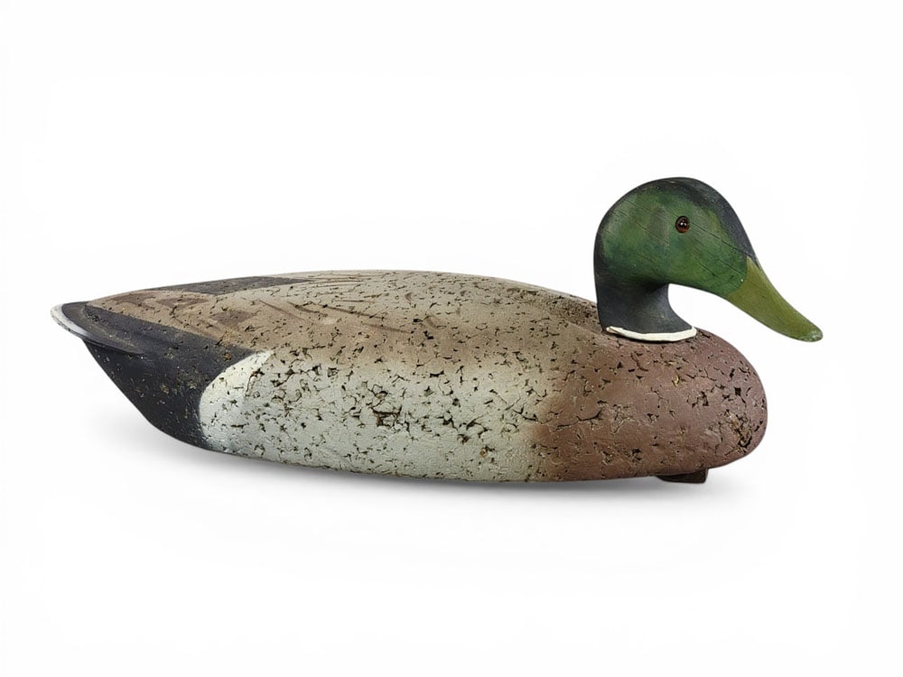 MALLARD CORK DECOY: 20th century. Mallard drake with original paint. 20" long. NOTE: We are happy to answer questions and take additional photos of lots prior to the auction (the sooner submitted the better). Any