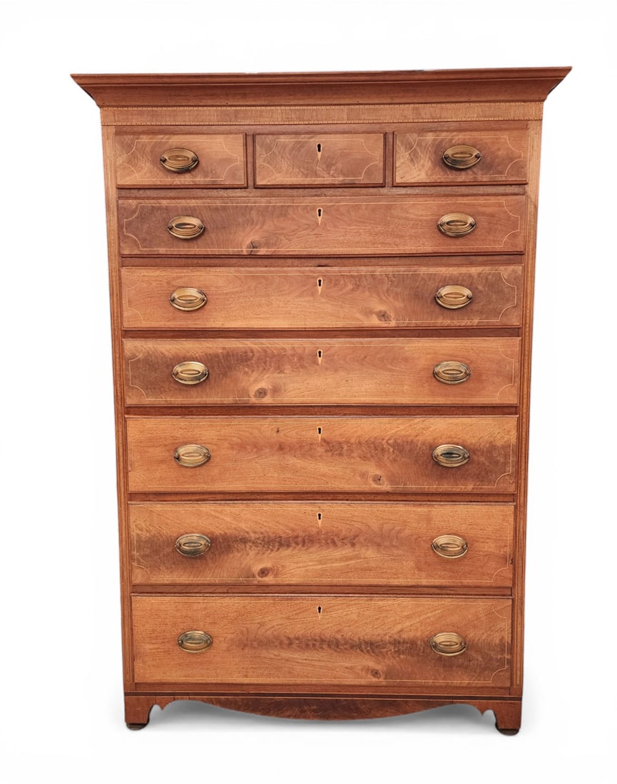 INLAID HEPPLEWHITE TALL CHEST: Pennsylvania, c. 1800, cherry and poplar. Three drawers over six graduated drawers with figured front and string inlay. Case with additional light and dark wood inlay. 66.25" high, 46" wide, and 24" d