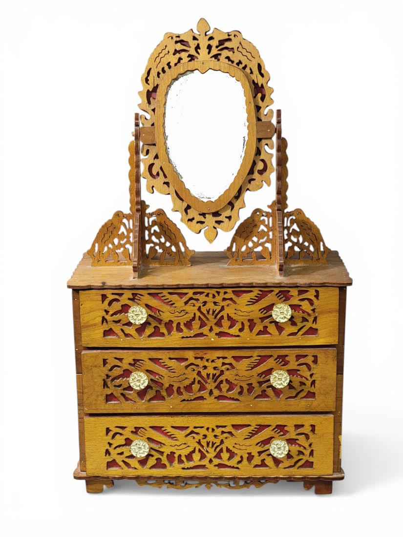 MINIATURE SCROLLWORK CHEST WITH MIRROR: American, 20th century. Three-drawer chest with wishbone mirror, entirely decorated in scrollwork with birds. 27" high, 15.5" wide, 7.5" deep. Provenance: a West Virginia collection. NOTE: We are