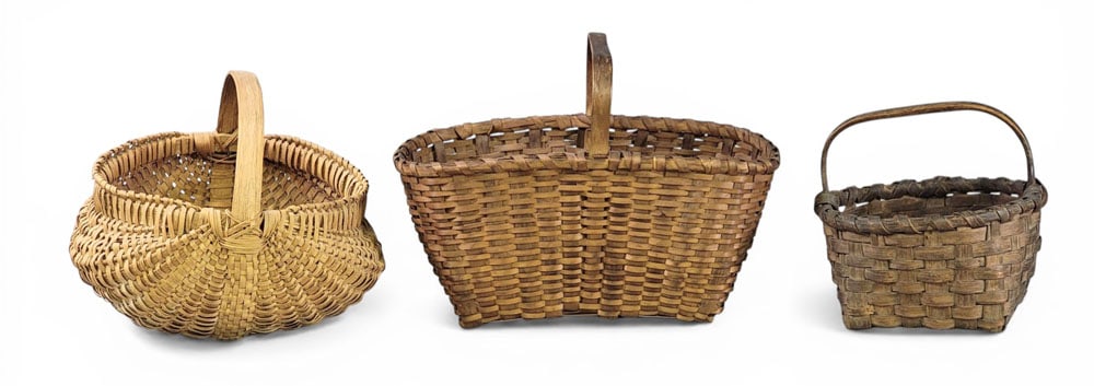 THREE HANDLED BASKETS: American, late 19th-early 20th century, oak splint. One buttocks, one oblong, one round. Oblong is 17" long. Provenance: Collection of Bob and Maxine Edwards, New Philadelphia, Ohio NOTE: We are happy