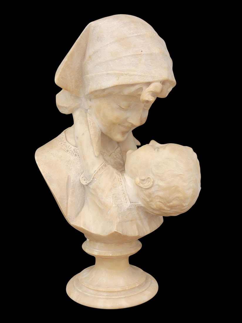 MATERNITA BY ANGIOLO MALAVOLTI (ITALY, 1876-1947): Alabaster, signed on the back. Bust of a happy mother holding her young child. 13" high. Provenance: a southwest Ohio collection. NOTE: We are happy to answer questions and take additional photos of l