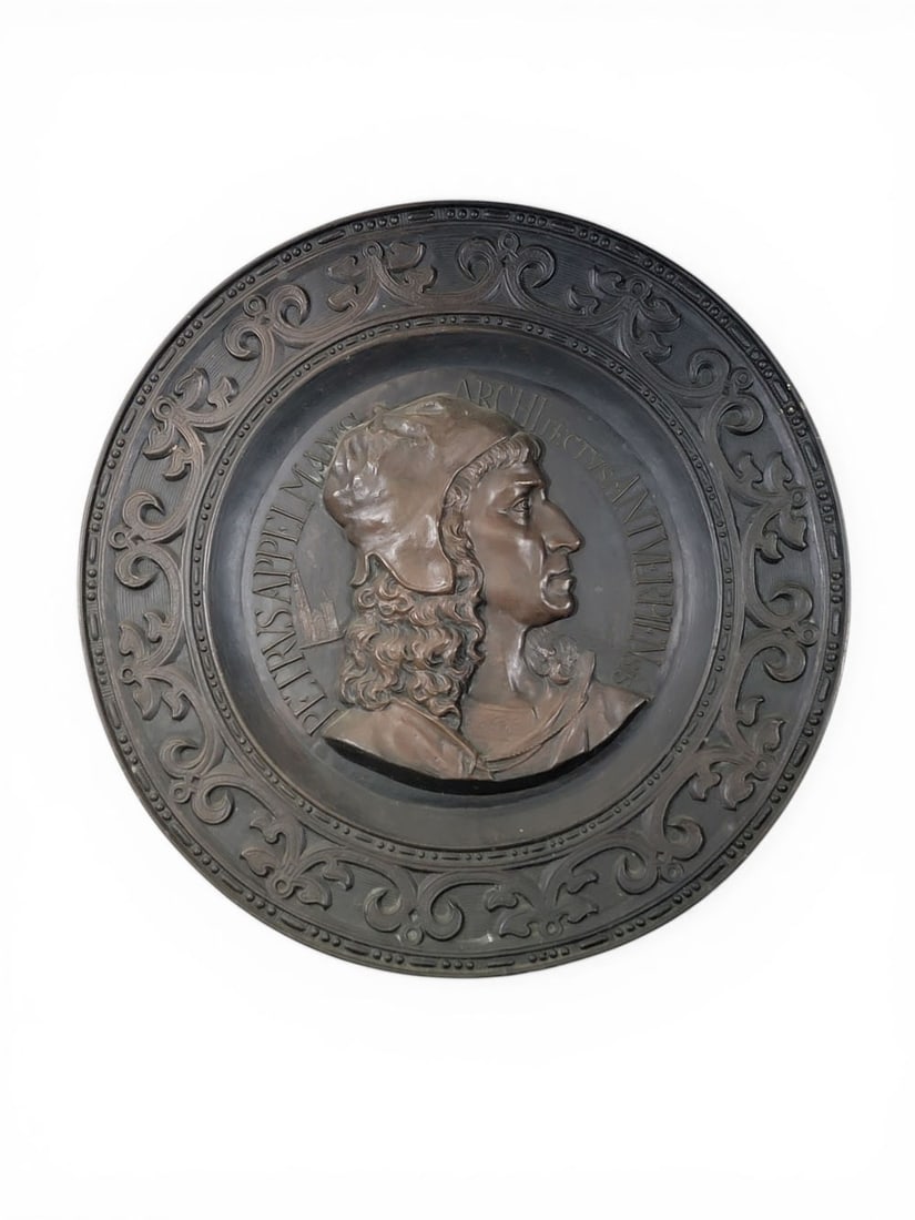 RELIEF PORTRAIT OF ARCHITECT PIETER APPELMANS: After Louis Francois Joseph Dupuis (1842-1921), European, late 19th century, patinated brass. Stamped relief profile bust "PETRVS APPELAMSN ARCHITECTVS ANTWERPIENSIS," signed near the chin. 33" diamet
