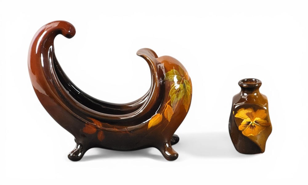 J.B. OWENS UTOPIAN COMPOTE & ATTRIBUTED CABINET VASE: Zanesville, Ohio, late 19th-early 20th century. Two pieces of art pottery, the first a boat-form, footed compote, with floral decoration, Utopian line, marked. 9" long; the second, a cabinet vase with