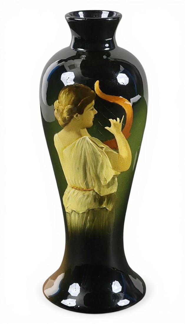 OHIO ART POTTERY VASE WITH A CLASSICAL PORTRAIT: Ohio, early 20th century. An inverted baluster form decorated with an exceptional portrait of a classically dressed woman playing the harp, unmarked. 10.5" high. Provenance: Collection of Ray and Eva