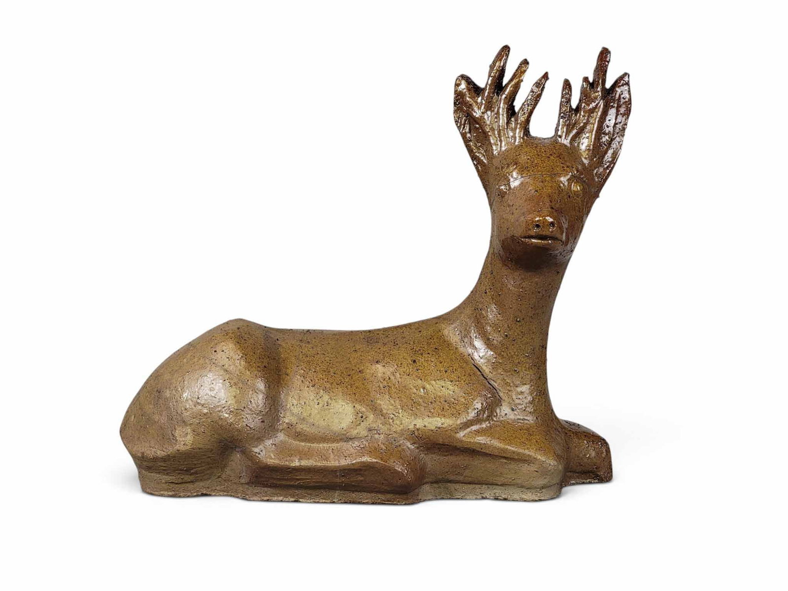 OHIO SEWER TILE DEER: Unmarked, but attributed to Walter Smith, Superior Clay Corp., Uhrichsville, 3rd quarter-20th century. Molded recumbent deer, glazed. 13" long. Provenance: an Ohio collection. NOTE: We are happy to