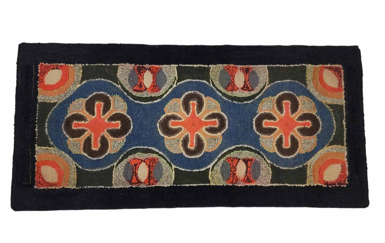 HOOKED RUG: American, 1st half-20th century. Colorful rug with stylized flowers on a black ground. 63" by 30". Provenance: from an Indiana collection. NOTE: We are happy to answer questions and take additional ph